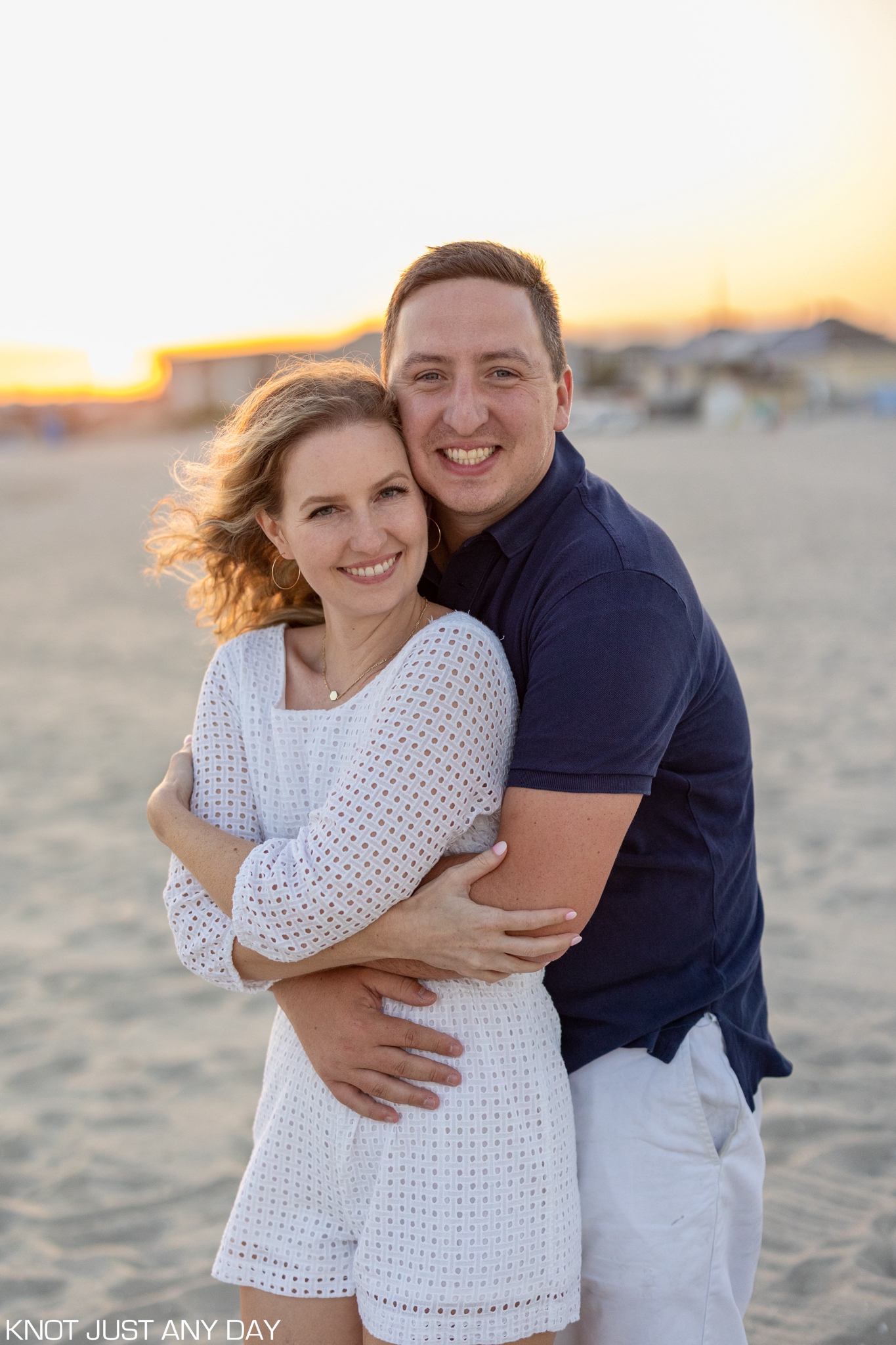 engagement photo of couple on the beach in Cape May, NJ