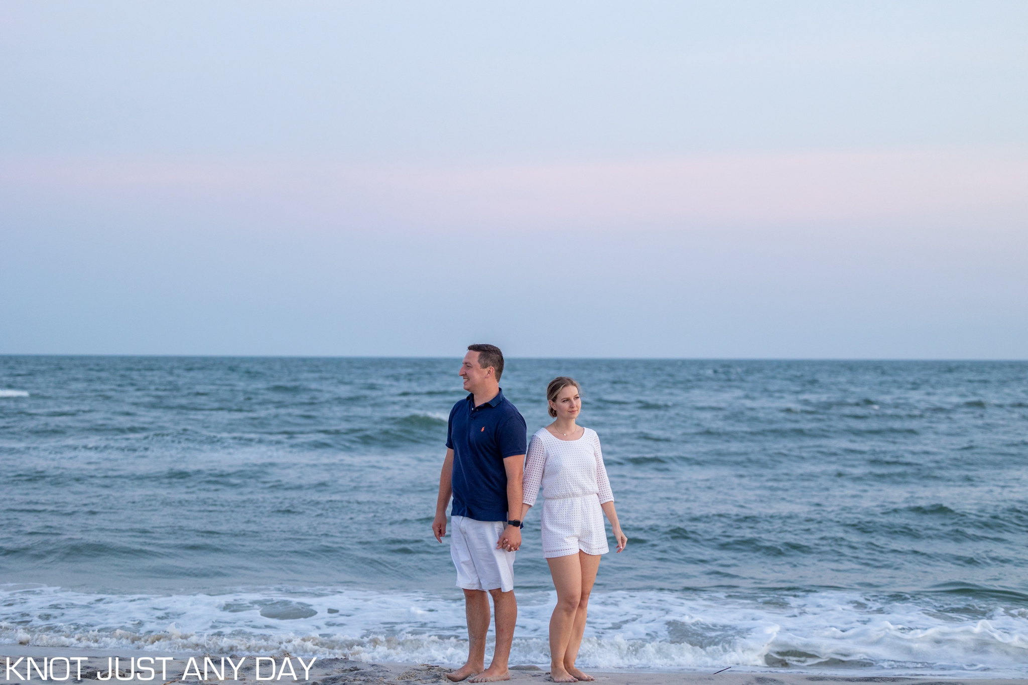 engagement photo of couple on the beach in Cape May, NJ during sunset