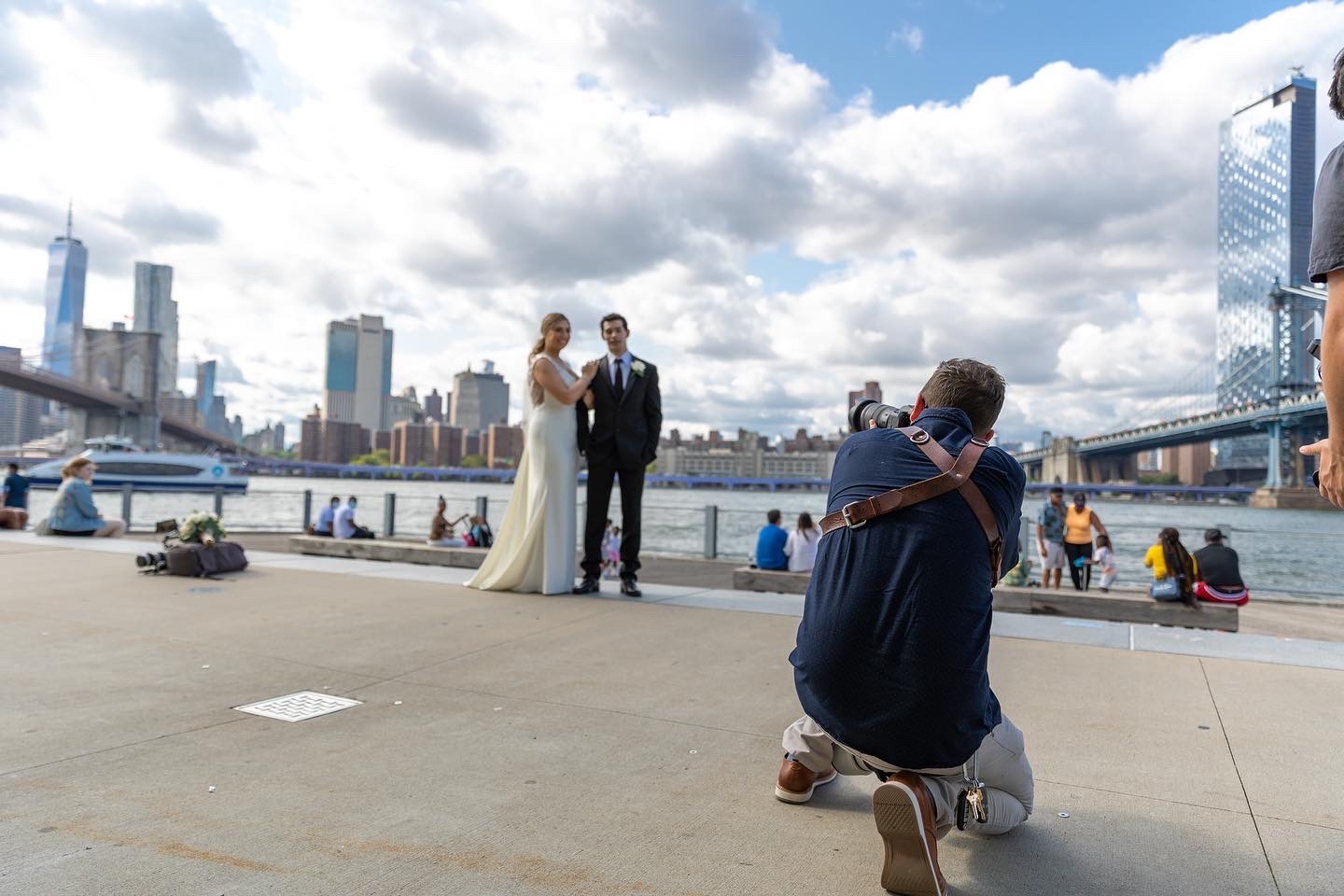 wedding photographer takes photo of bride and groom in New York City