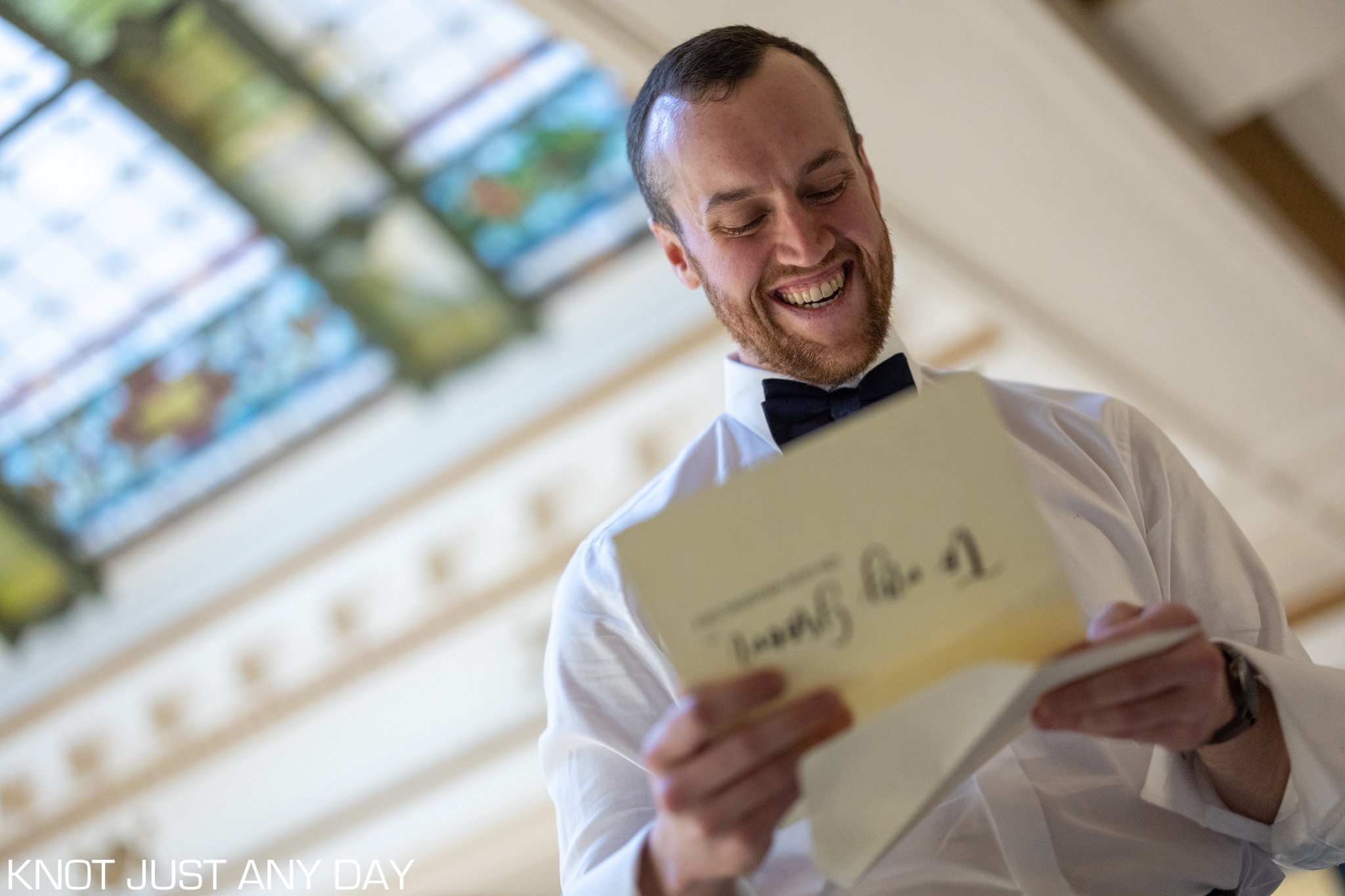 groom reads letter from bride at the Radisson lackawanna station hotel in scranton, pa